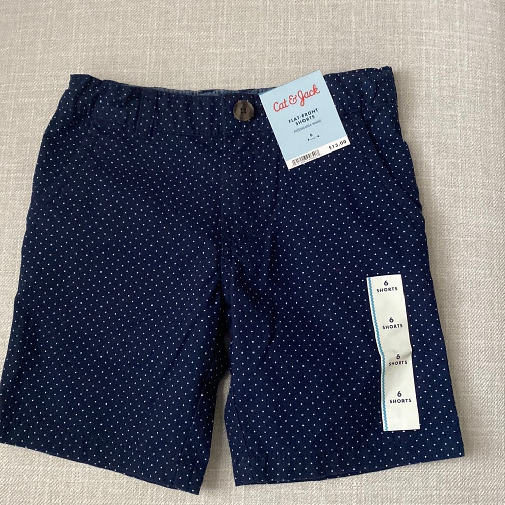 BRAND NEW shorts, color blue with white dots. Size 6.